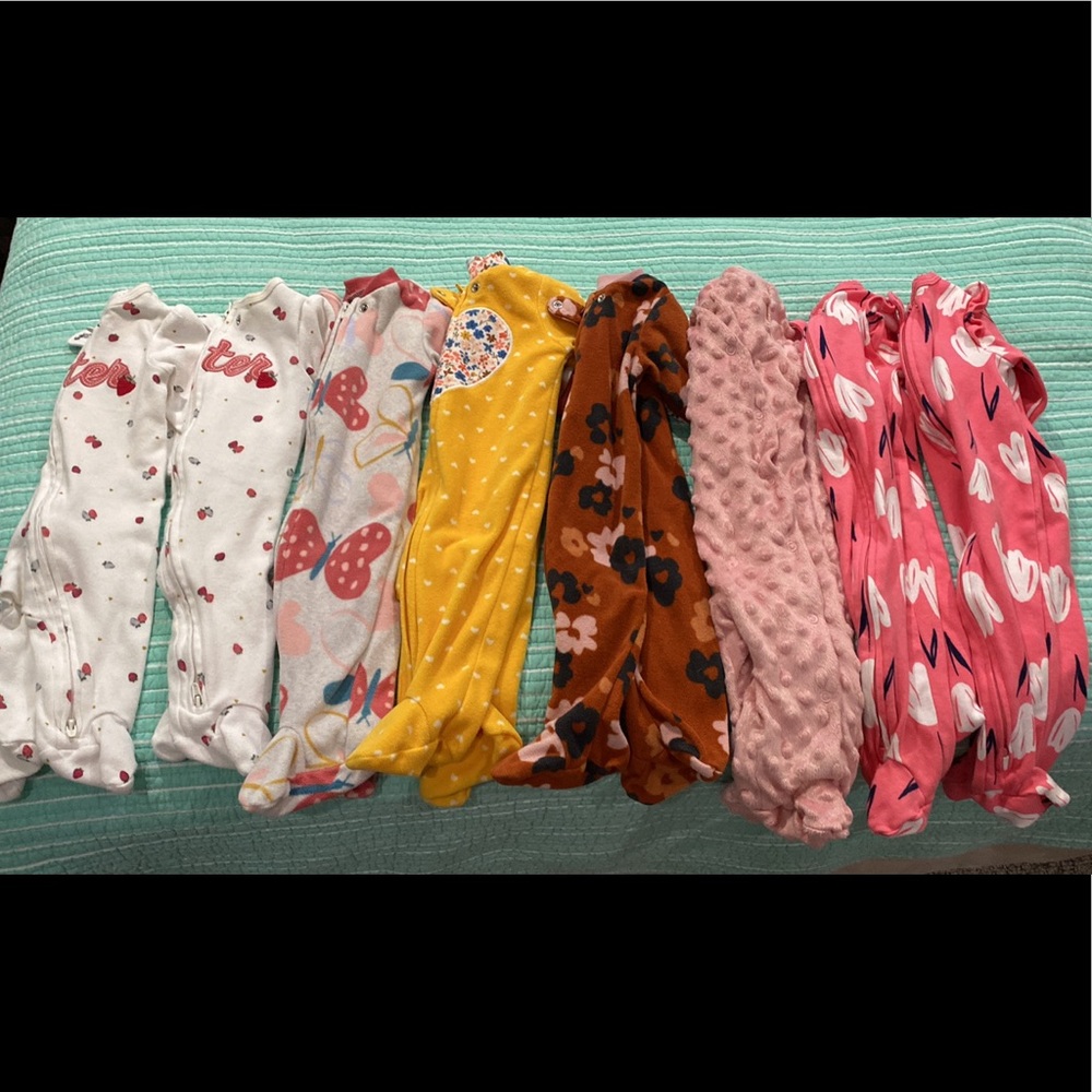 8 Carter’s Sleep & Play outfits. 7 are by Carter’s.
